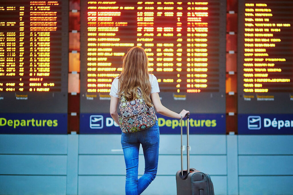 Checking the departure board at the airport and overcoming your fear of flying.