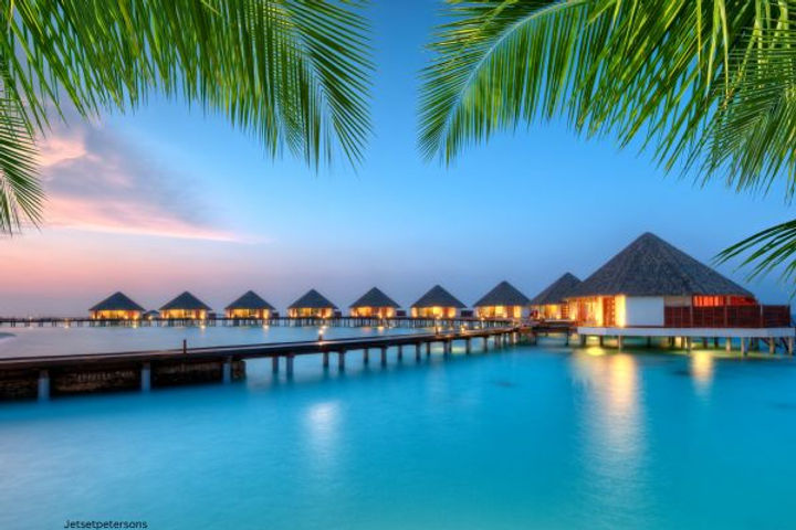 Maldives is the ultimate tropical paradise, with its overwater bungalows, crystal-clear waters, and vibrant coral reefs