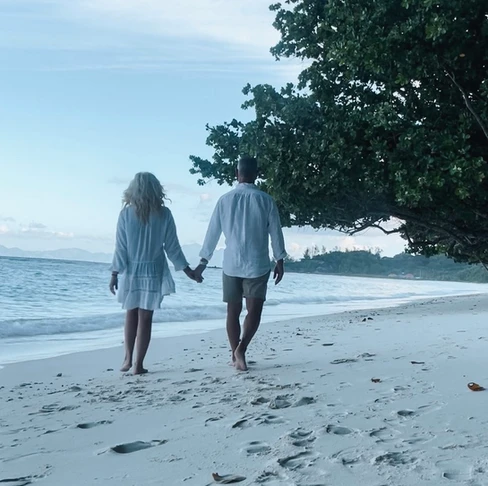 walking on the beach in the seychelles