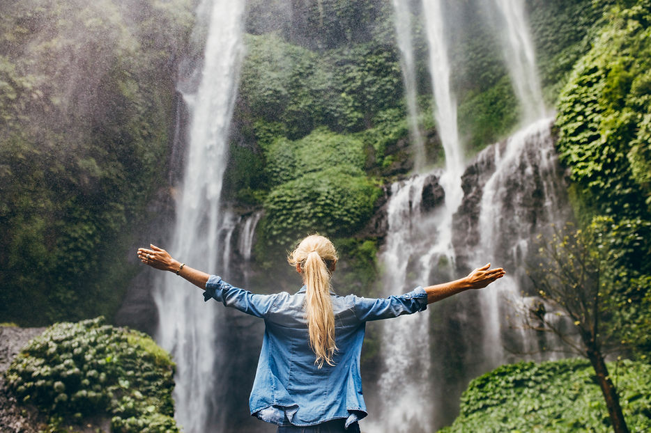 woman at waterfall