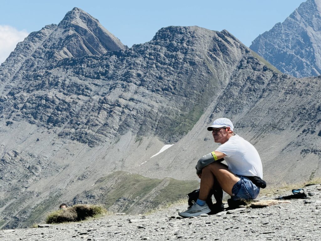man sitting on the tour du mont blanc